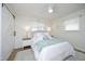 Bright main bedroom featuring luxury bedding, ceiling fan and ample sunlight at 2320 Marks Creek Rd, Knightdale, NC 27545