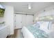 Comfortable main bedroom featuring a decorative sliding barn door at 2320 Marks Creek Rd, Knightdale, NC 27545