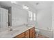 Bathroom with double sinks, tub, and updated features at 2575 Primrose Ln, Creedmoor, NC 27522