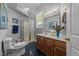Well-lit bathroom with a glass-enclosed shower and a vanity with a marble countertop at 2637 S Nc 87, Graham, NC 27253