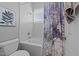 Bathroom featuring a shower and tub combo and neutral colors at 2637 S Nc 87, Graham, NC 27253