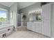 Bright bathroom with a garden tub, tiled shower, and spacious vanity with ample storage at 2637 S Nc 87, Graham, NC 27253