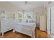 Bedroom with hardwood floors and natural light at 2637 S Nc 87, Graham, NC 27253