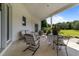 Inviting covered patio with ample seating, perfect for relaxing and enjoying the outdoor views at 2637 S Nc 87, Graham, NC 27253