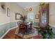 Elegant dining room with a wooden table, chandelier, and decorative accents at 2637 S Nc 87, Graham, NC 27253