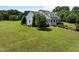 Charming two-story home with a manicured lawn, mature trees, and a welcoming front porch at 2637 S Nc 87, Graham, NC 27253