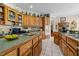 Well-equipped kitchen with custom wood cabinets and contrasting countertops at 2637 S Nc 87, Graham, NC 27253