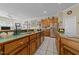 Kitchen featuring wooden cabinets and stainless steel appliances overlooking the living room at 2637 S Nc 87, Graham, NC 27253