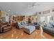 Spacious living room with hardwood floors and views to the kitchen and dining areas at 2637 S Nc 87, Graham, NC 27253
