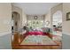 Open-concept living room with hardwood floors, decorative rugs, and access to adjacent rooms at 2637 S Nc 87, Graham, NC 27253
