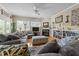 Comfortable living room featuring a fireplace, plush seating, and plenty of natural light at 2637 S Nc 87, Graham, NC 27253