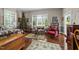 Spacious primary bedroom features a four poster bed, seating, a Christmas tree and natural light at 2637 S Nc 87, Graham, NC 27253