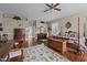 Large main bedroom with hardwood floors, area rugs, and ample space for a sitting area at 2637 S Nc 87, Graham, NC 27253