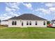 Back of the house featuring ample windows and newly installed sod at 30 Chloe Ct, Selma, NC 27576