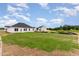 Wide backyard features freshly installed grass in an establishing community at 30 Chloe Ct, Selma, NC 27576