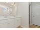 Bright bathroom featuring a double vanity with quartz countertops and modern fixtures at 30 Chloe Ct, Selma, NC 27576