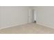 Neutral bedroom with plush carpeting, showing the doorway to an attached room at 30 Chloe Ct, Selma, NC 27576