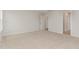 Bedroom showcasing neutral carpet and a doorway at 30 Chloe Ct, Selma, NC 27576