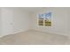 Bedroom featuring neutral carpet and a window at 30 Chloe Ct, Selma, NC 27576
