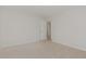 Spacious bedroom with neutral carpet and view of a doorway at 30 Chloe Ct, Selma, NC 27576