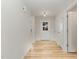 Bright entryway with wood floors, white walls, and a view of the front door at 30 Chloe Ct, Selma, NC 27576