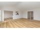 Open-concept living area with bright wood flooring and neutral walls for versatile decor at 30 Chloe Ct, Selma, NC 27576