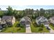 Aerial view of a beautiful two-story home with a well-manicured lawn in a suburban neighborhood at 3032 Curling Creek Drive Dr, Apex, NC 27502