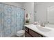 Well-lit bathroom with decorative shower curtain and vanity at 3032 Curling Creek Drive Dr, Apex, NC 27502