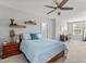 Bright bedroom featuring a blue quilt, wooden furniture, and an abundance of natural light at 3032 Curling Creek Drive Dr, Apex, NC 27502