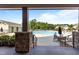 View from clubhouse showcasing the community pool, lounge chairs, and neatly kept grounds at 3032 Curling Creek Drive Dr, Apex, NC 27502