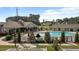 Inviting community pool and clubhouse area with lounge chairs and well-maintained landscaping at 3032 Curling Creek Drive Dr, Apex, NC 27502