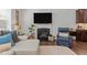 Cozy fireplace and mantle featured in a bright living room at 3032 Curling Creek Drive Dr, Apex, NC 27502