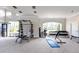 Well-equipped fitness center with weight machines, free weights, and large windows at 3032 Curling Creek Drive Dr, Apex, NC 27502