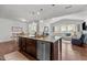 Open concept kitchen island featuring granite countertops and stainless steel dishwasher at 3032 Curling Creek Drive Dr, Apex, NC 27502