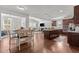 Open-concept living space with kitchen, dining area, and living room for seamless entertaining at 3032 Curling Creek Drive Dr, Apex, NC 27502