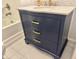 Bathroom vanity with blue cabinet, gold hardware and marble top at 306 Penny St, Garner, NC 27529