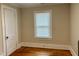 Bedroom boasts hardwood floors, a window, and white door at 306 Penny St, Garner, NC 27529