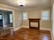 Living room with hardwood floors, natural light, and classic architectural features at 306 Penny St, Garner, NC 27529