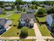 An aerial view showcasing the home, well-maintained landscaping, and surrounding neighborhood at 3101 Riverbrooke Dr, Raleigh, NC 27610