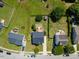 Aerial view of a home, showing backyard, detached garage, patio, deck, and neighborhood at 3101 Riverbrooke Dr, Raleigh, NC 27610