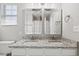 Well-lit bathroom with double vanity and granite countertop, perfect for a Gathering at 3101 Riverbrooke Dr, Raleigh, NC 27610