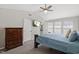 Bedroom with TV, closet door and windows for natural light, with a dresser at 3101 Riverbrooke Dr, Raleigh, NC 27610
