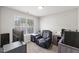 Office/bedroom space featuring a comfy black chair, desk, and natural light at 3101 Riverbrooke Dr, Raleigh, NC 27610