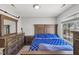 Traditional bedroom with a matching wood bedroom set and large window at 3101 Riverbrooke Dr, Raleigh, NC 27610