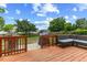 Cozy wood deck area with a grill, shed and comfortable outdoor seating at 3101 Riverbrooke Dr, Raleigh, NC 27610