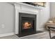 Cozy living space featuring a fireplace with a decorative white mantel at 3101 Riverbrooke Dr, Raleigh, NC 27610