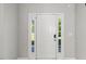 Front door with sidelights and modern electronic lock at 3101 Riverbrooke Dr, Raleigh, NC 27610