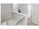 Well-lit hallway with neutral carpet leads to various rooms at 3101 Riverbrooke Dr, Raleigh, NC 27610