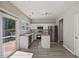 Modern kitchen with stainless steel appliances, granite countertops, and a sliding door to the deck at 3101 Riverbrooke Dr, Raleigh, NC 27610