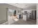 Bright kitchen with stainless steel appliances, white cabinets, and an island with granite countertops at 3101 Riverbrooke Dr, Raleigh, NC 27610